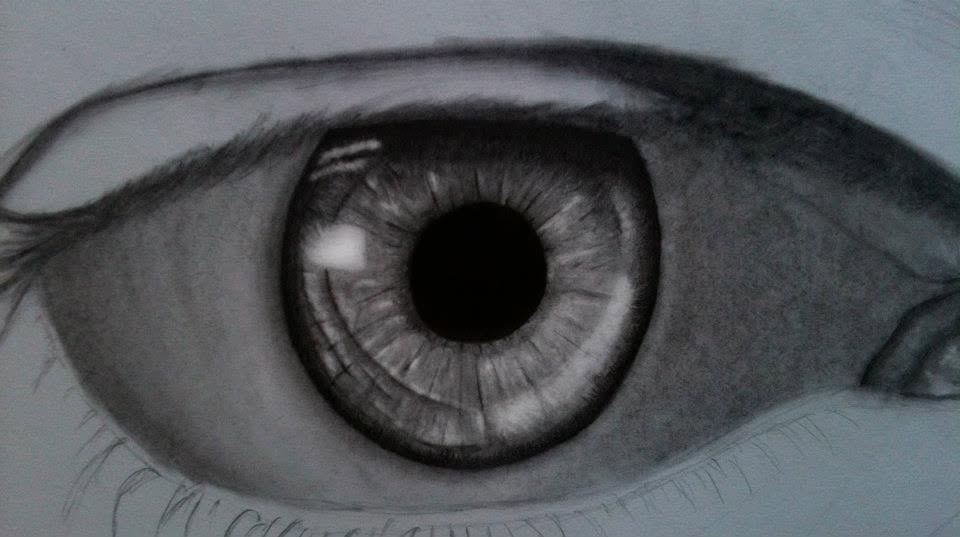 A charcoal drawing of an eye