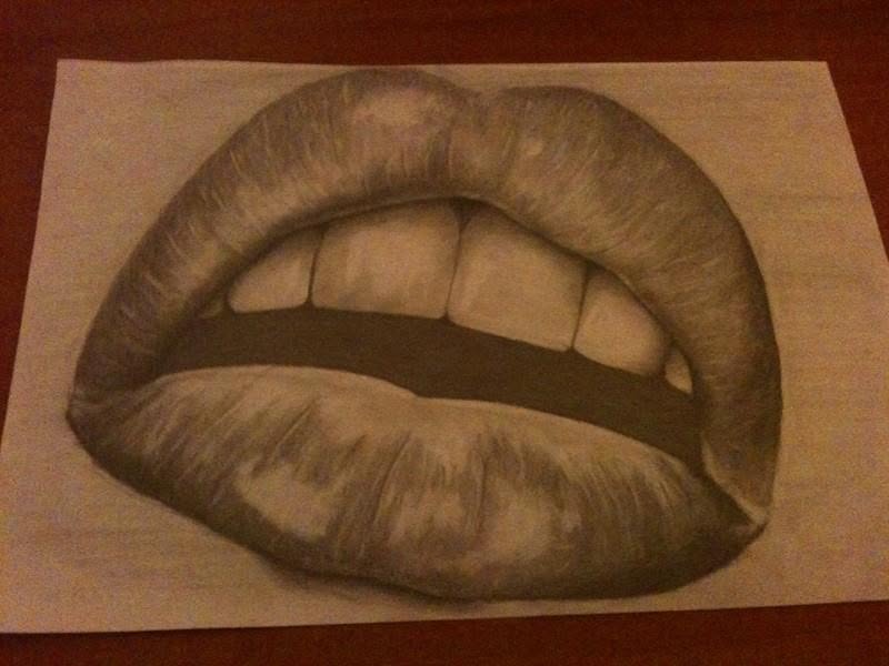A charcoal drawing of lips and teeth
