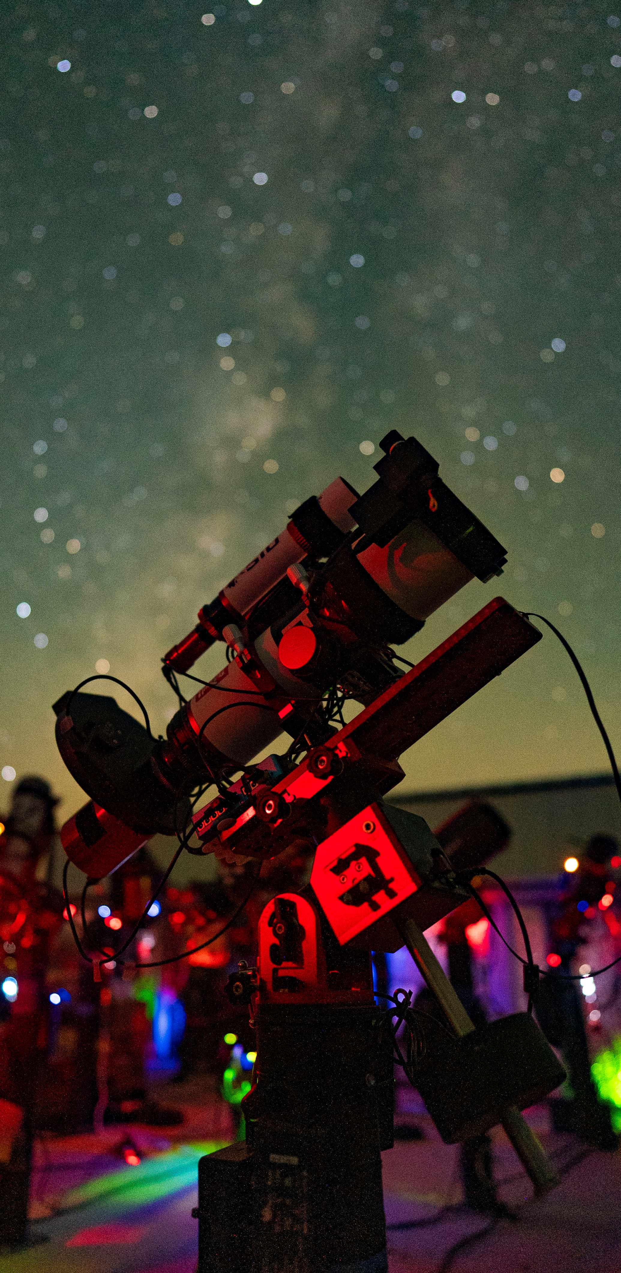 Telescope under a dark night sky